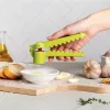 Ručný lis na cesnak Ototo Design Garligator zelená plast oceľ
