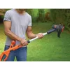 Black & Decker ST182320-QW akumulátorový strunový vyžínač, 18 V, 2,0 Ah Li-Ion, šírka kosenia 25 cm, s akumulátorom a nabíjačkou, oranžový/čierny