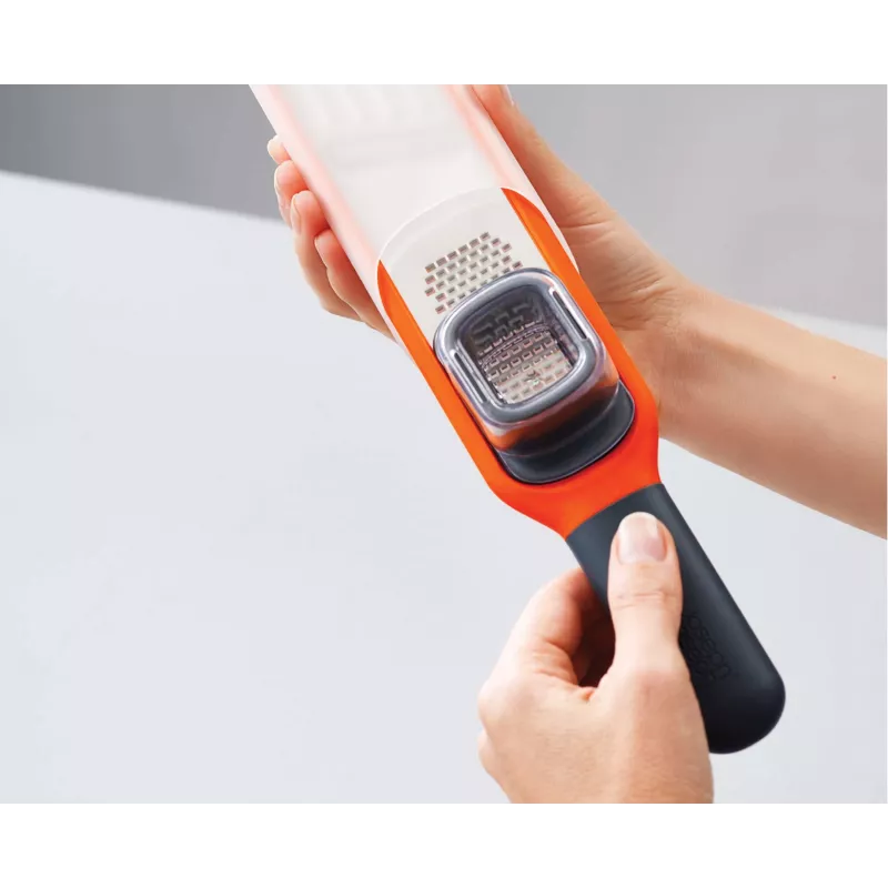 Joseph Joseph Handi-Grate 2-in-1 mini strúhadlo a hobľovač - oranžová - nerezová oceľ