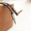 UGREEN AV119 3,5-mm plochý aux kábel s pravouhlým konektorom, 2 m - čierny/strieborný